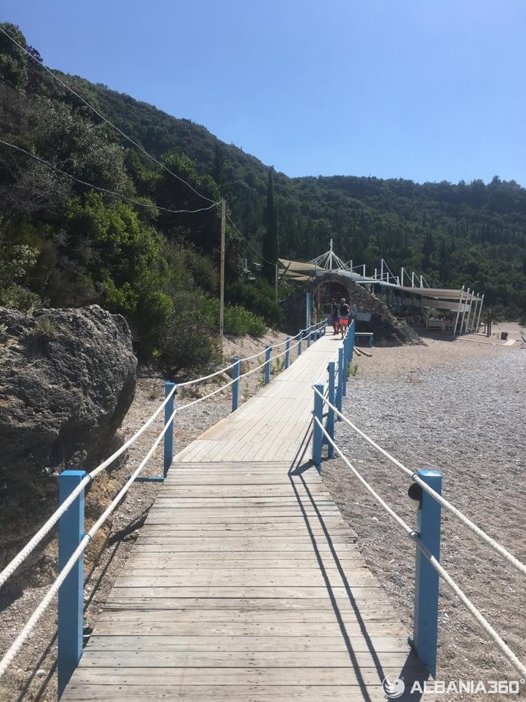 walkway bridge leading to livadhi beach in himare, albania