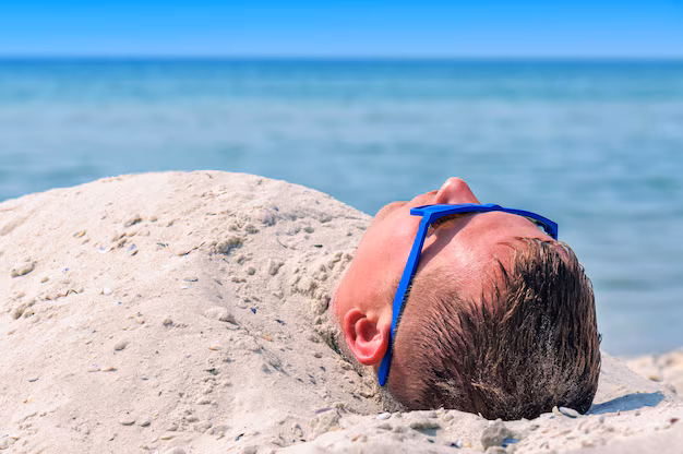 man buried beach sand summer vacatiom theme 203337 1091.jpg